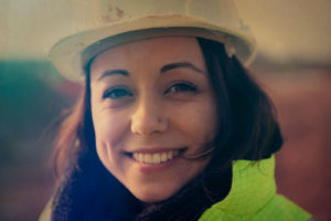 Smiling woman in hard hat
